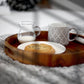 tray with coffee cup, small milk jar, and chocolate chip cookies